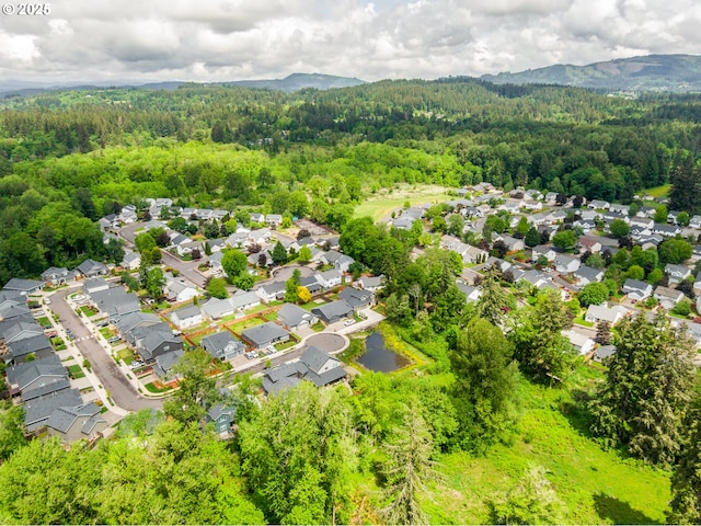 1602 NE 16th Ct, Battle Ground, WA 98604 - aerial perspective of suburban area with a heavily wooded area and mountains