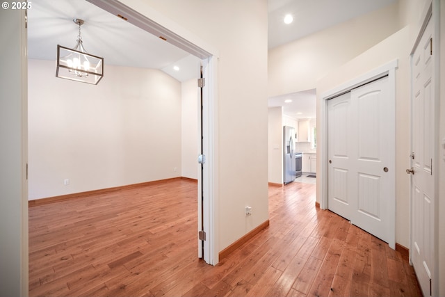1602 NE 16th Ct, Battle Ground, WA 98604 - hall featuring light wood finished floors, a chandelier, recessed lighting, and baseboards