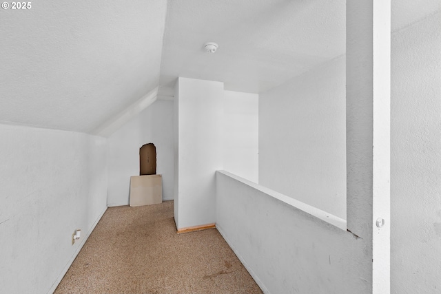 180 W Second Ave, Sutherlin, OR 97479 - hallway with lofted ceiling, carpet floors, and a textured ceiling