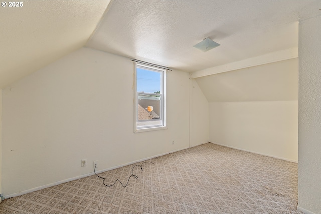 180 W Second Ave, Sutherlin, OR 97479 - additional living space with lofted ceiling, carpet flooring, baseboards, and a textured ceiling