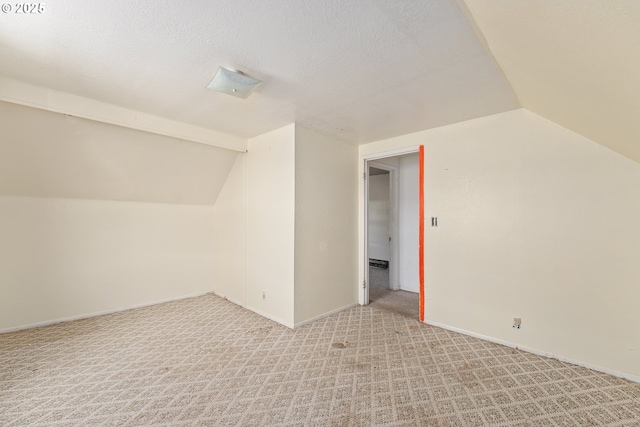 180 W Second Ave, Sutherlin, OR 97479 - additional living space featuring vaulted ceiling, light colored carpet, and baseboards