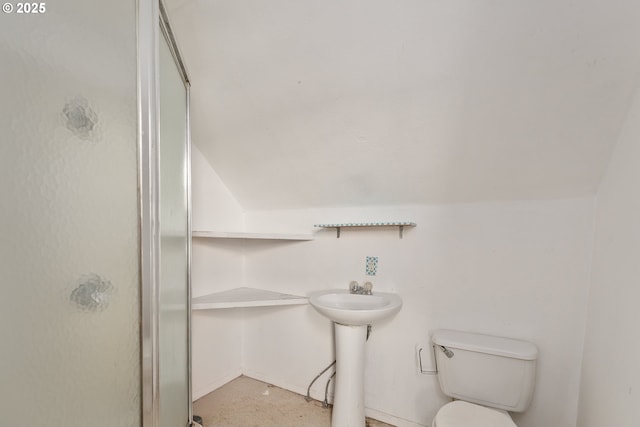 180 W Second Ave, Sutherlin, OR 97479 - bathroom with a stall shower, toilet, a sink, and vaulted ceiling