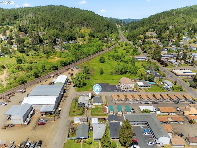 180 W Second Ave, Sutherlin, OR 97479 - aerial view of property's location featuring a heavily wooded area