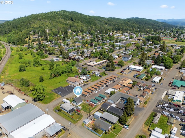 180 W Second Ave, Sutherlin, OR 97479 - aerial view of property and surrounding area with a heavily wooded area and nearby suburban area