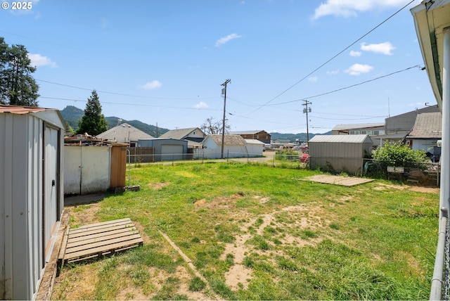 180 W Second Ave, Sutherlin, OR 97479 - view of yard featuring a storage shed and an outbuilding