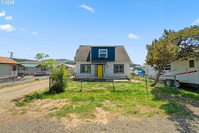 180 W Second Ave, Sutherlin, OR 97479 - view of front of house featuring fence, roof with shingles, and stucco siding