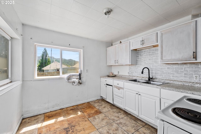 180 W Second Ave, Sutherlin, OR 97479 - kitchen featuring a sink, electric stove, tasteful backsplash, and white cabinetry
