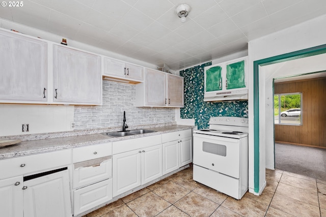 180 W Second Ave, Sutherlin, OR 97479 - kitchen with white range with electric cooktop, a sink, under cabinet range hood, decorative backsplash, and light tile patterned floors