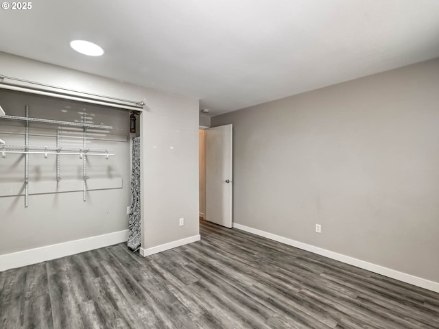 12642 NW Barnes Rd Unit 10, Portland, OR 97229 - unfurnished bedroom featuring wood finished floors and a closet
