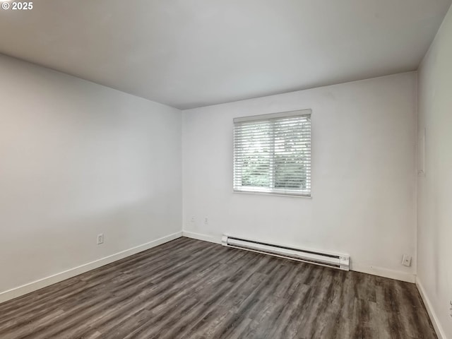 12642 NW Barnes Rd Unit 10, Portland, OR 97229 - empty room featuring a baseboard radiator and dark wood-style flooring
