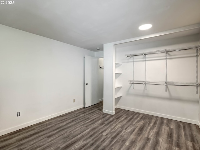 12642 NW Barnes Rd Unit 10, Portland, OR 97229 - unfurnished bedroom with dark wood finished floors, recessed lighting, and a closet