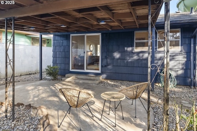 view of patio featuring fence