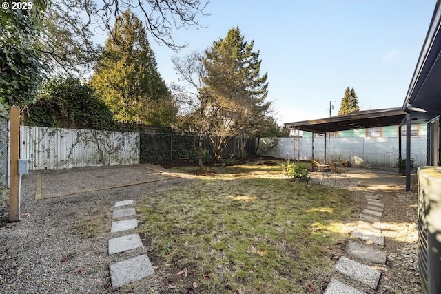 view of yard with a patio area and a fenced backyard