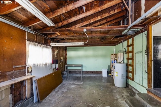 basement featuring gas water heater and a garage