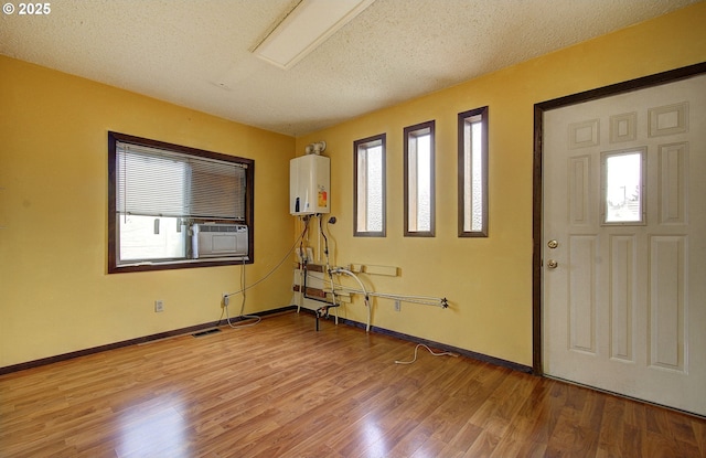 8400 Cason Rd, Gladstone, OR 97027 - entryway featuring water heater, plenty of natural light, and light wood-style flooring