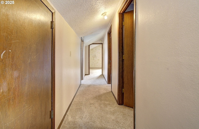 8400 Cason Rd, Gladstone, OR 97027 - corridor featuring a textured ceiling, light colored carpet, and lofted ceiling