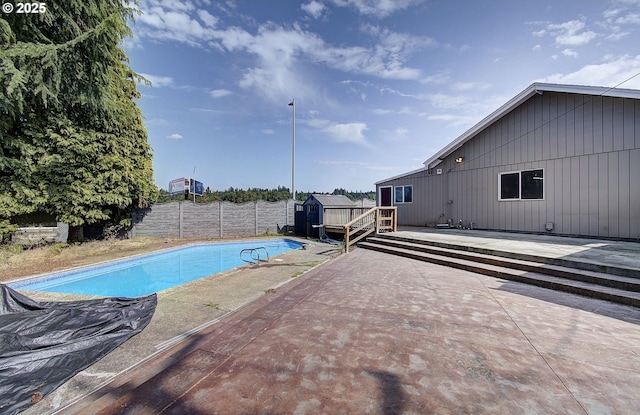 8400 Cason Rd, Gladstone, OR 97027 - view of swimming pool with a shed, a patio, a fenced backyard, and a deck