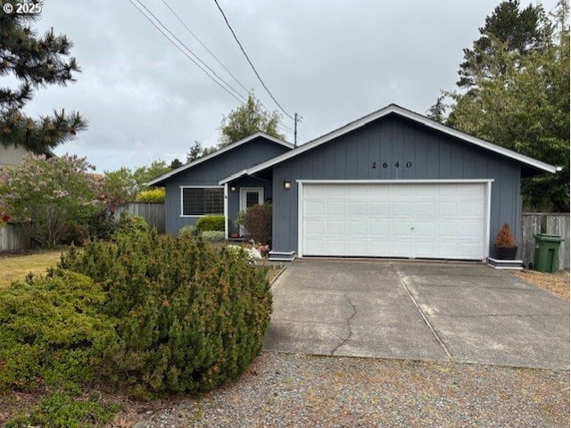 2640 Virginia Ave, North Bend, OR 97459 - single story home with concrete driveway and a garage