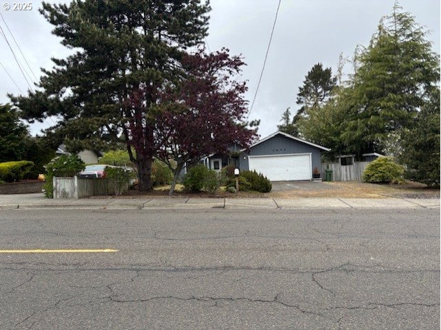 2640 Virginia Ave, North Bend, OR 97459 - view of front of house with an attached garage and fence