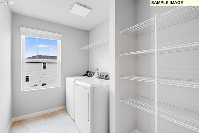 891 Legacy St, Eugene, OR 97402 - laundry area with washing machine and dryer and light tile patterned floors