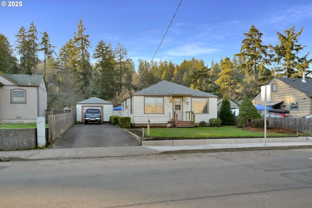 1648 Augusta St, Eugene, OR 97403 - view of front facade with driveway, a detached garage, and an outdoor structure