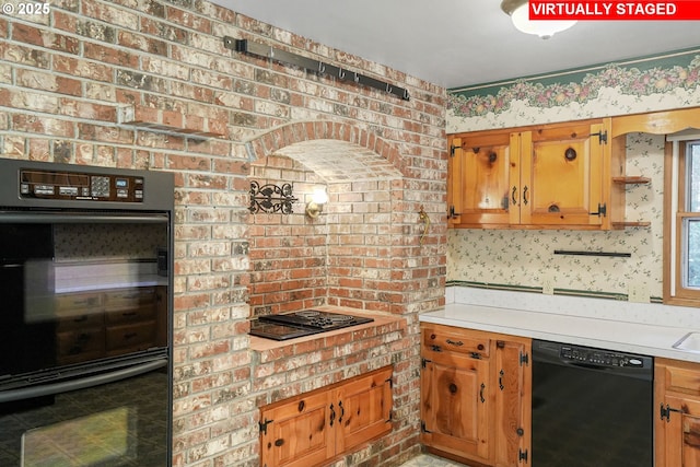 kitchen featuring wallpapered walls, light countertops, brown cabinetry, black appliances, and open shelves