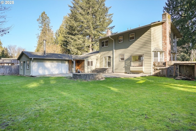 rear view of property with a patio, a lawn, fence, and a chimney