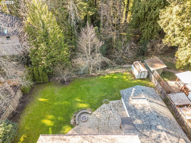 view of yard with an outbuilding and a shed