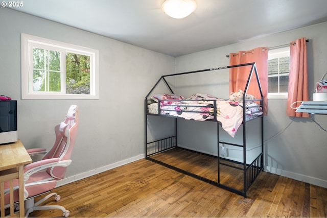 3426 Royal Ave, Eugene, OR 97402 - bedroom with wood-type flooring, multiple windows, and baseboards