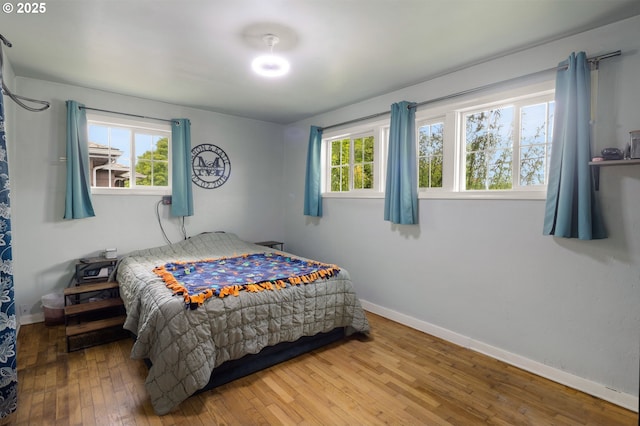 3426 Royal Ave, Eugene, OR 97402 - bedroom with hardwood / wood-style floors, multiple windows, and baseboards