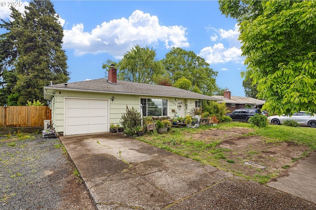 3426 Royal Ave, Eugene, OR 97402 - ranch-style house with driveway, an attached garage, and a chimney