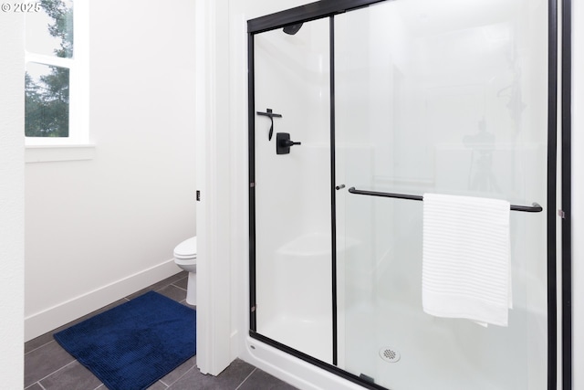 19386 Juniper Ct, Oregon City, OR 97045 - full bathroom featuring toilet, baseboards, tile patterned flooring, and a stall shower