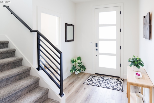 19386 Juniper Ct, Oregon City, OR 97045 - foyer featuring light wood-type flooring, baseboards, and stairway