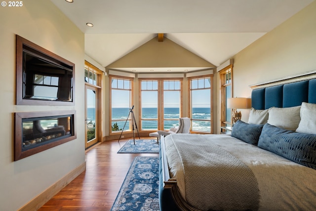 280 Fall Creek Dr, Oceanside, OR 97134 - bedroom featuring a water view, wood finished floors, access to exterior, baseboards, and recessed lighting