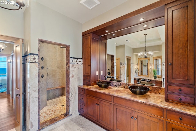 280 Fall Creek Dr, Oceanside, OR 97134 - bathroom with a chandelier, a walk in shower, and vanity