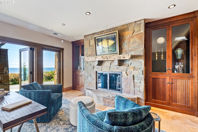 280 Fall Creek Dr, Oceanside, OR 97134 - living area with a stone fireplace, recessed lighting, and baseboards