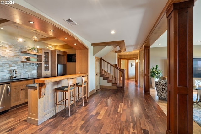 280 Fall Creek Dr, Oceanside, OR 97134 - indoor wet bar featuring dark wood-type flooring, stairs, recessed lighting, baseboards, and dishwasher