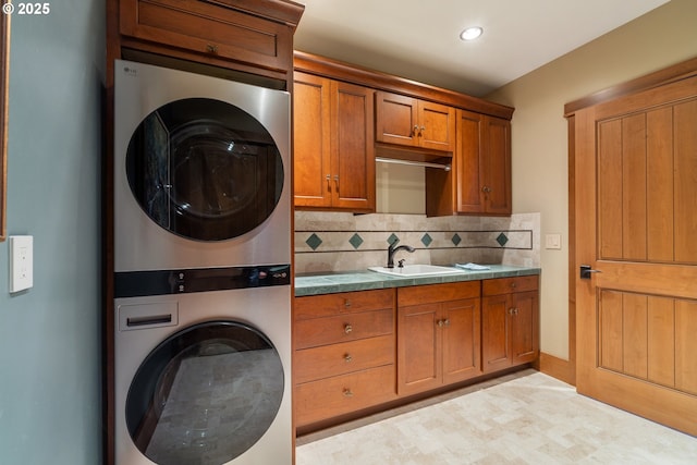 280 Fall Creek Dr, Oceanside, OR 97134 - washroom with estacked washer and dryer, cabinet space, recessed lighting, and baseboards