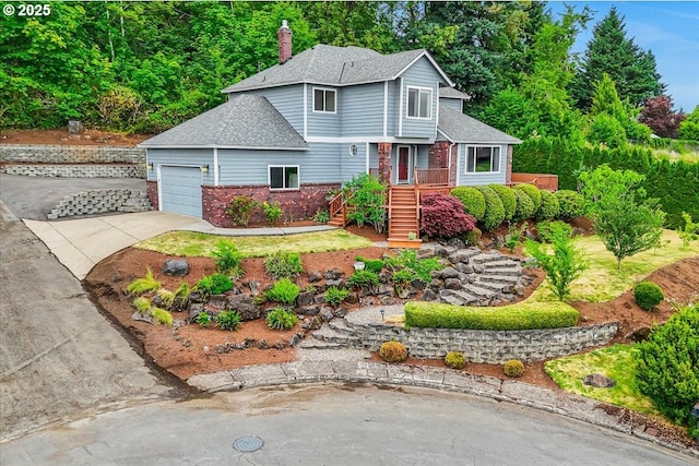 8311 Greenann Ct, Gladstone, OR 97027 - view of front of property with roof with shingles, a garage, driveway, brick siding, and a chimney