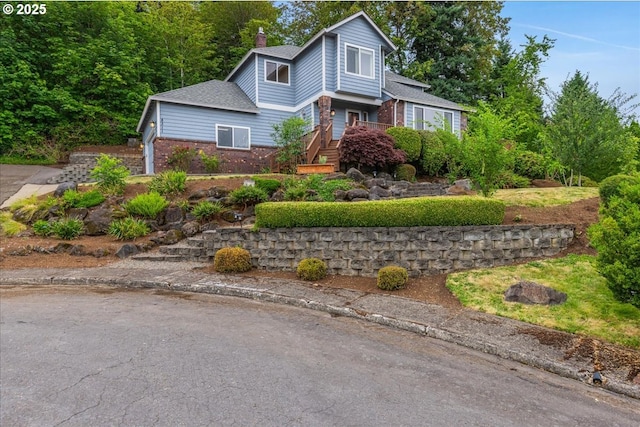 8311 Greenann Ct, Gladstone, OR 97027 - view of front of home with brick siding, a chimney, and a shingled roof