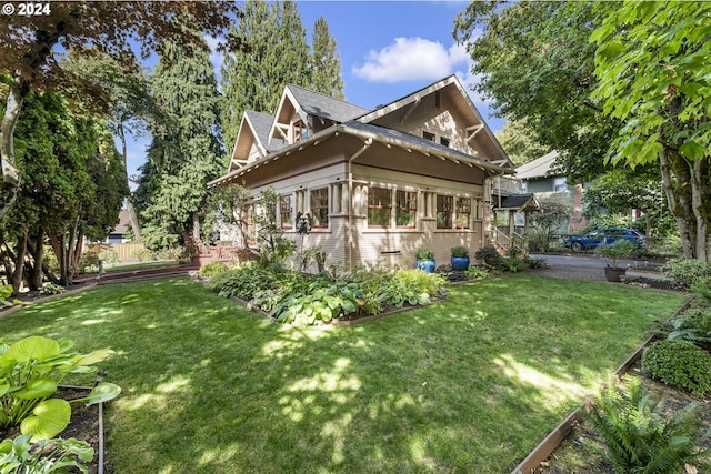 view of property exterior featuring a yard