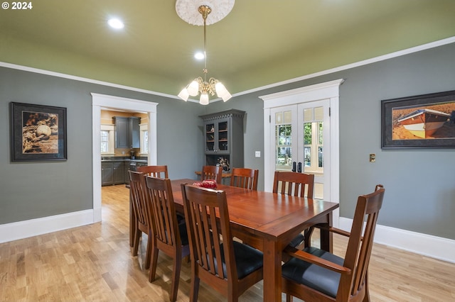 dining room featuring a notable chandelier and light hardwood / wood-style flooring