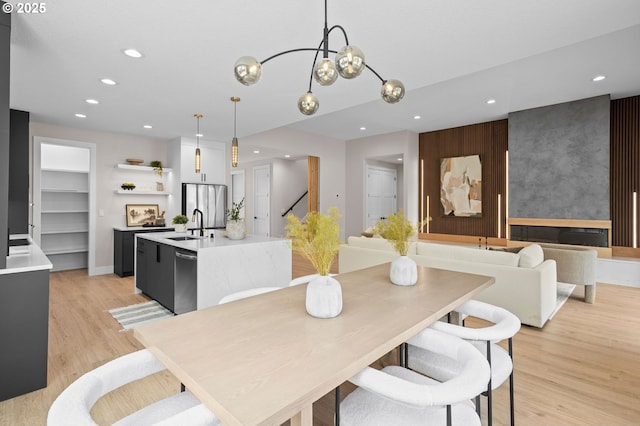 6803 NW 24th Ct, Vancouver, WA 98665 - dining area with recessed lighting, light wood-style floors, stairs, built in features, and a chandelier