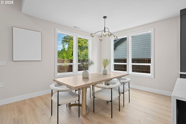6803 NW 24th Ct, Vancouver, WA 98665 - dining space featuring light wood-style flooring and a chandelier