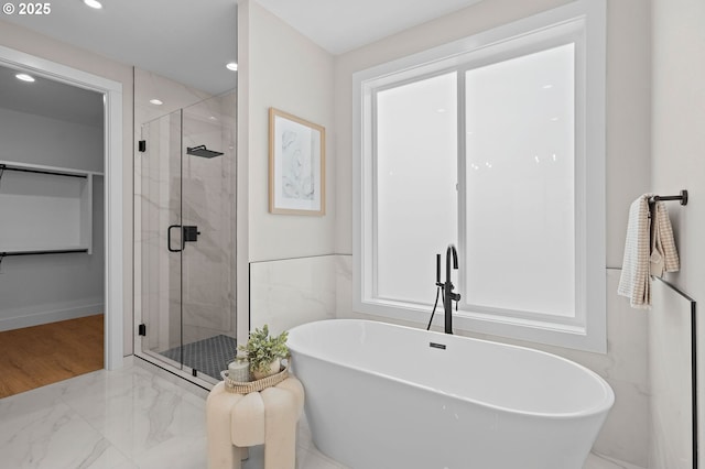 6803 NW 24th Ct, Vancouver, WA 98665 - full bath featuring a freestanding tub, a stall shower, a walk in closet, recessed lighting, and marble finish flooring