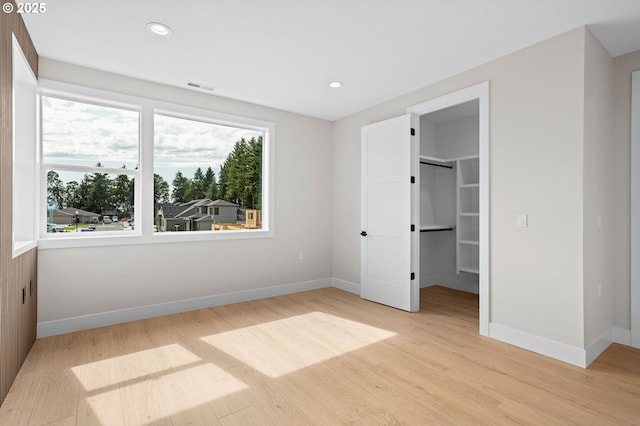6803 NW 24th Ct, Vancouver, WA 98665 - unfurnished bedroom featuring light wood-style flooring, a spacious closet, recessed lighting, and a closet