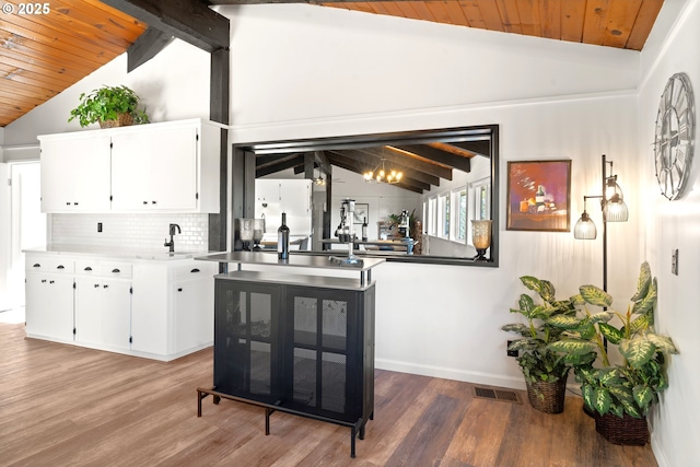 32890 Hillside Acres Rd, Gold Beach, OR 97444 - bar with wooden ceiling, vaulted ceiling with beams, light wood finished floors, and freestanding refrigerator