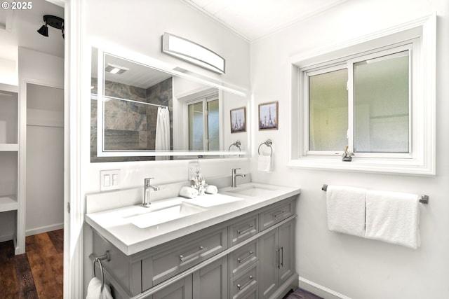 32890 Hillside Acres Rd, Gold Beach, OR 97444 - bathroom featuring a sink, wood finished floors, and baseboards