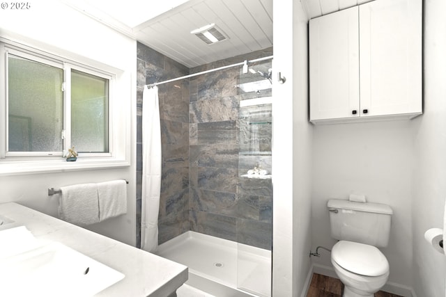 32890 Hillside Acres Rd, Gold Beach, OR 97444 - full bath with a tile shower, toilet, visible vents, and vanity