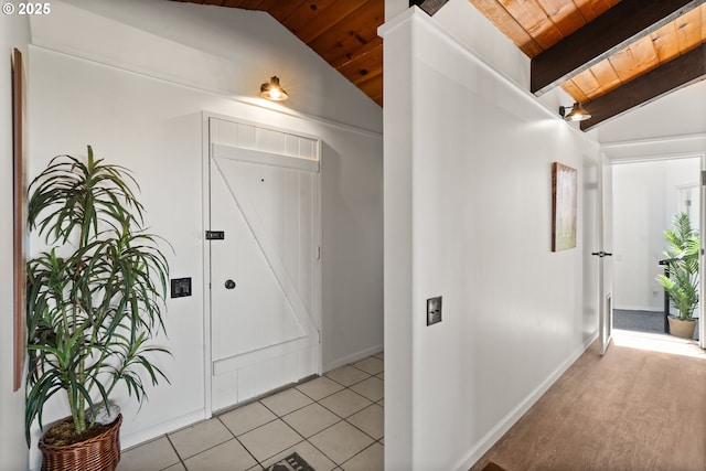 32890 Hillside Acres Rd, Gold Beach, OR 97444 - hall featuring lofted ceiling with beams, wooden ceiling, and light tile patterned floors